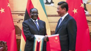Zimbabwe's President Robert Mugabe (L) and his Chinese counterpart Xi Jinping 