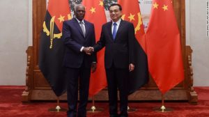 Angolan President Jose Eduardo Dos Santos (L) shakes hands with Chinese Premier Li Keqiang (R)