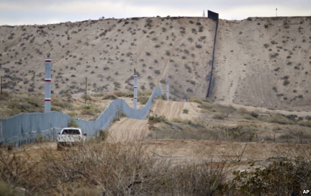 FILE - A U.S. Border Patrol agent drives near the U.S.-Mexico border fence in Sunland Park, N.M. The building of a border wall was one of the main tenets of the Donald Trump campaign.